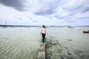 Girl walking on the beach