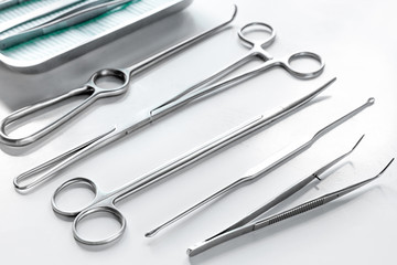 Medical instruments for cosmetic surgery on white table backgrond