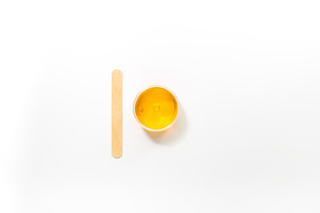 Wax and stick for depilation on white background top view copyspace