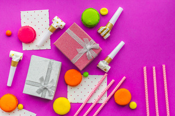Birthday greeting cards and wrapped gifts on fuchsia background top view copyspace