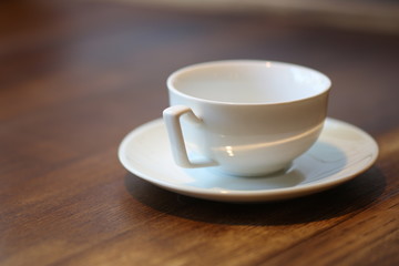 Empty cup on a saucer. Close up