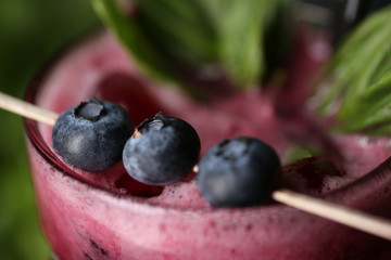 Glass of fruit smoothie. Close up