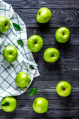 Fototapeta na wymiar summer food with green apples on dark background top view