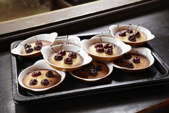 Close-up of cherry ramekins on tray