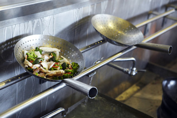 Stir fry in colanders