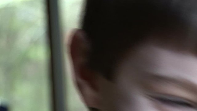 Boy (10 Yrs) crossing eyes and laughing, close up