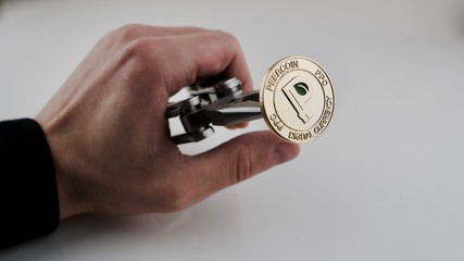 Gold peercoin in hand