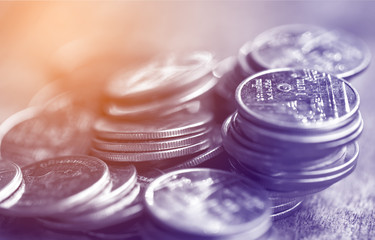 Row of coins on wood background for finance and Saving concept,Investment, Economy, Soft focus and dark style.