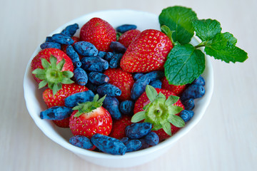   Strawberries and blue honeysuckle berries