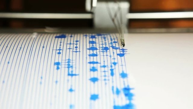 A seismograph machine actively recording ground tremors, Mount St Helens, Johnston Ridge Observatory, Washington