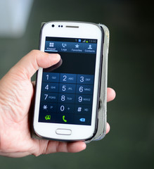 Touch screen mobile phone, in hand