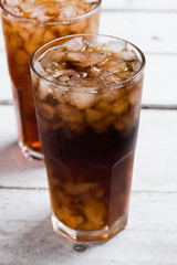 Cola drink glass on white table