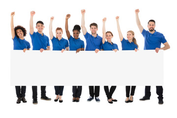 Obraz premium Happy Multiracial Janitors With Banner
