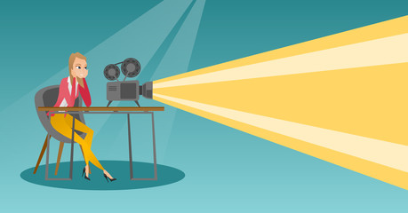 Caucasian projectionist showing a new film.