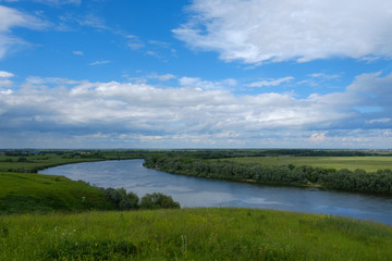 Fototapeta na wymiar Summer landscape with views of the river from the high Bank