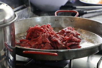 Beef while being cooked