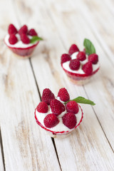 Trifle sweet dessert with raspberries.