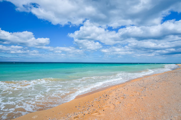 Fototapeta premium Beach sand and sky with clouds 