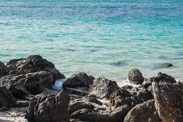 Fototapeta na wymiar Rocks on the beach in the evening.