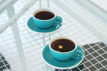 Hot americano - Closeup a cup of coffee on concrete table background, Morning Breakfast.