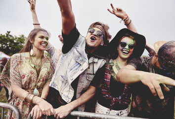 Group of friends dancing in front of stage