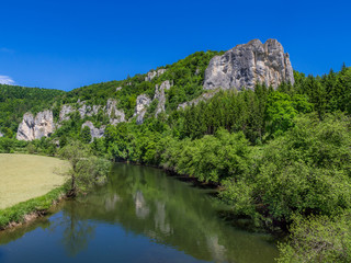 Fototapeta na wymiar Rabenfelsen at the Danube River near Thiergarten on Upper Danube Valley, Swabian Alb, Baden Wuerttemberg, Germany, Europe