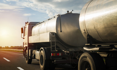 Truck on the highway pulling load. Road and transportation concept.