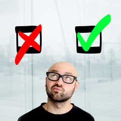 Portrait of a geek man who has difficult choices to make - Decision concept
