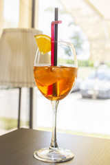 Alcohol bar, cocktail glass on the bar counter, cocktail glass in a bar. Drinking cocktails. Fresh drink cocktail on a color background.