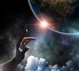 Obraz na płótnie Canvas Touching planet with finger