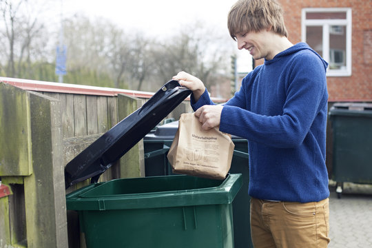 Guy throwing out trash