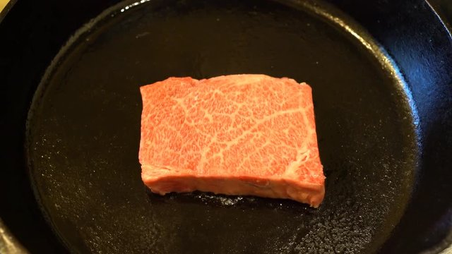 Delicious 4K video of frying Wagyu Beef steak in a pan at home