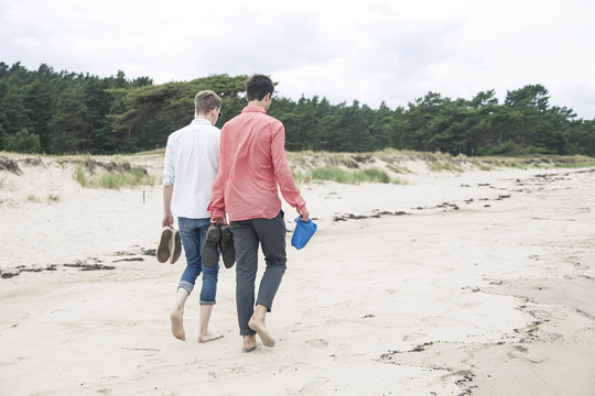Boys walking by the sea in Sweden