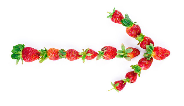 Ripe red strawberry arrow isolated on white background. Top view. Flat lay.