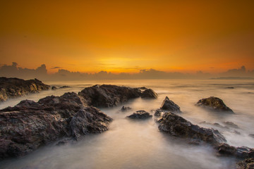 Long exposure shot of beautiful sunrise located at Pantai Pandak, Terengganu, Malaysia. Soft focus due to long exposure shot