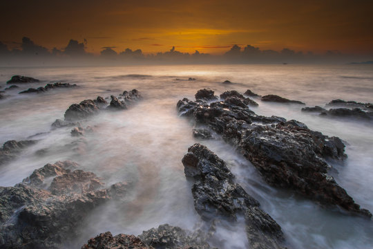 Long exposure shot of beautiful sunrise located at Pantai Pandak, Terengganu, Malaysia. Soft focus due to long exposure shot