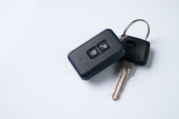 Car key and alarm system charm isolated on a white background with copy spase. car key with remote control