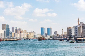 Obraz premium View of Dubai creek on a beautiful day, Deira district, Dubai, United Arab Emirates, UAE