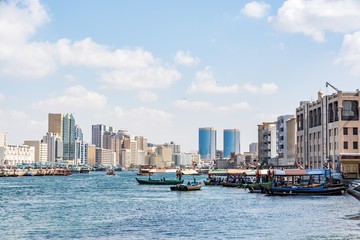 Obraz premium View of Dubai creek on a beautiful day, Deira district, Dubai, United Arab Emirates, UAE
