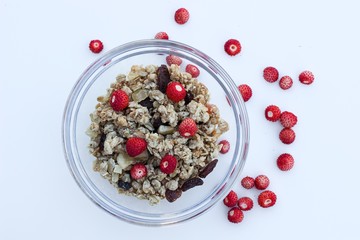 crunchy muesli and fresh wild strawberries