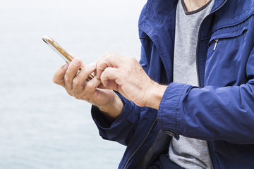 Senior man using cellphone