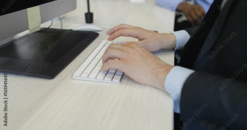 Aufkleber business man typing on computer keyboard sitting at office desk working in creative open space with 