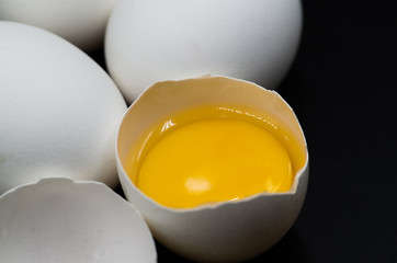 fresh eggs on the black background