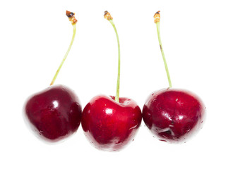 Juicy red cherry on a white background