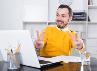 Man communicate by video at office