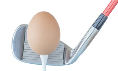 Action hen egg in front of golf club on white background, healthcare lifestyle concept.