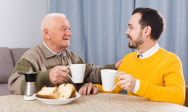 Elderly father and son breakfast