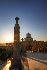 Tbilisi, Georgia - 8 October 2016: sunset view on Main gates entrance and cross to Tbilisi Sameba Cathedral (Holy Trinity) biggest Orthodox Cathedral in Caucasus