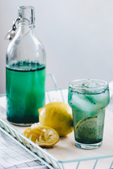 Spirulina lemonade with fresh lemon and ice