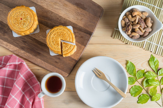 Mooncake With Tea Cup And Nuts. Top View.